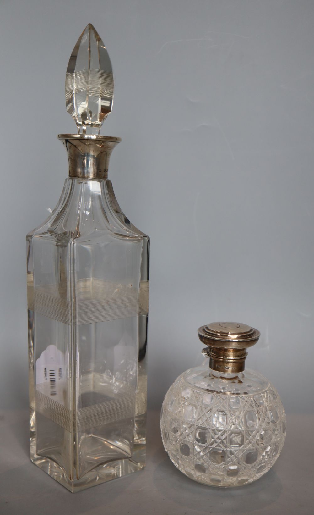 An Art Deco silver-mounted square section glass decanter, Hukin & Heath, Birmingham 1922, 35.5cm and a cut glass scent bottle,